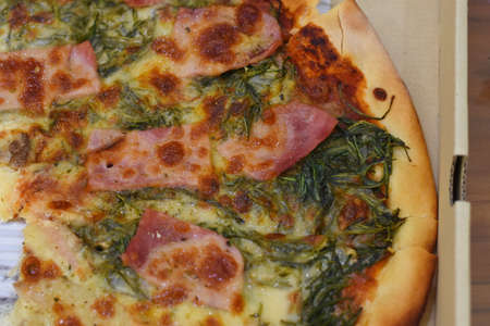 Pizza with bacon and spinach. Close-upの写真素材