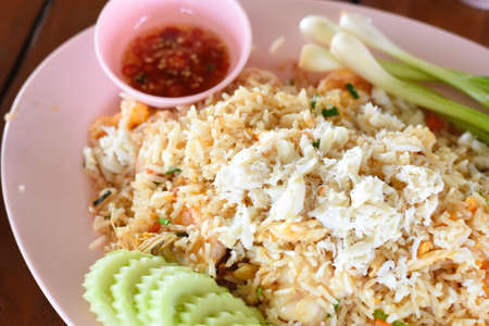 Fried rice with crab and vegetable, Thai style food in restaurantの写真素材