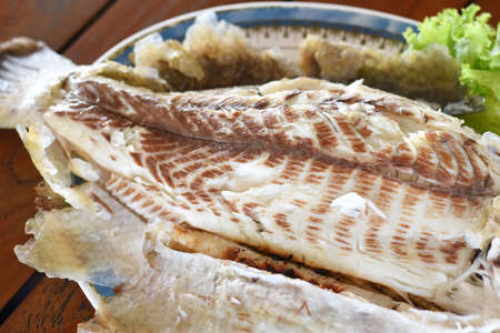 Grilled fish on a plate,Thai style grilled fish.の写真素材