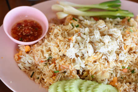 Fried rice with crab and vegetable in thai style food.の写真素材