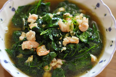 Stir-fried spinach with shrimps in a bowl.の写真素材