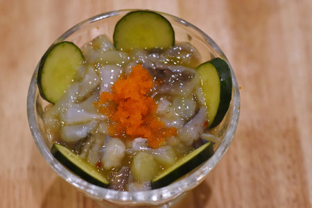 Sashimi in a glass with cucumber