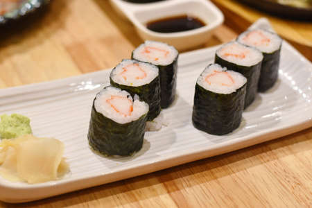 Sushi rolls on a white plate with wasabi and soy sauceの写真素材
