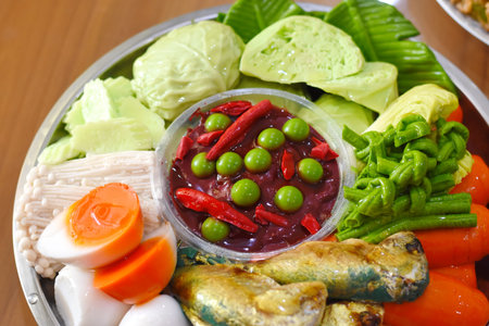 spicy sauce with fish, egg, vegetables and other ingredients