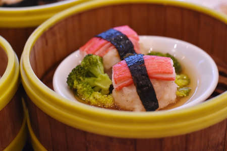 japanese food - steamed sushi in bamboo basket on tableの写真素材