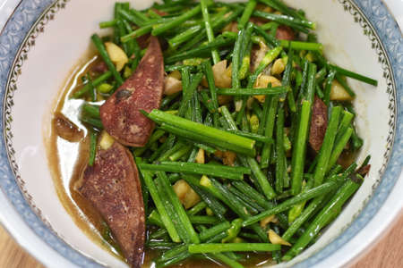 Chinese cuisine, stir fried green beans with pork and garlic in a bowlの写真素材