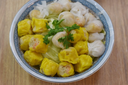 chinese steamed dumpling stuffed with shrimp in blue bowl