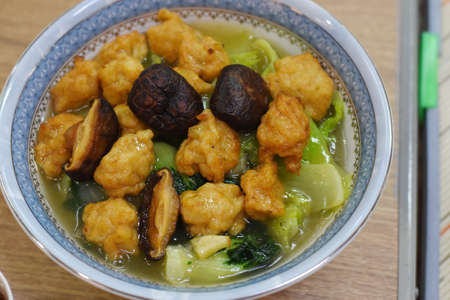 Fried mushrooms with sweet and sour sauce in bowlの写真素材