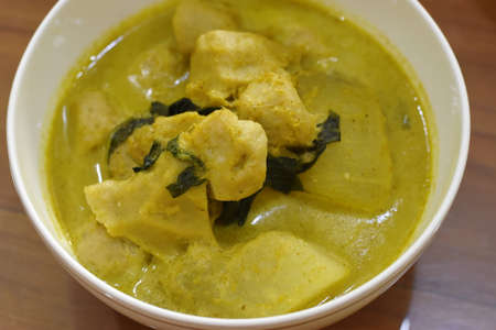 Green curry chicken with coconut milk in a bowl, Thai food.の写真素材