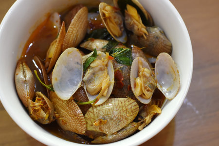 Steamed clams with chili sauce in bowl, Thai food.の写真素材