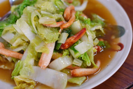 Stir fried Chinese cabbage with shrimps on white plate.の写真素材