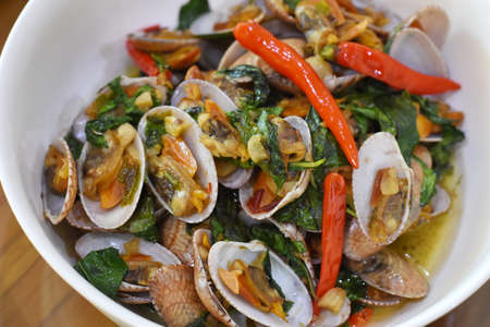 Spicy stir-fried clams with chili and basil, Thai foodの写真素材