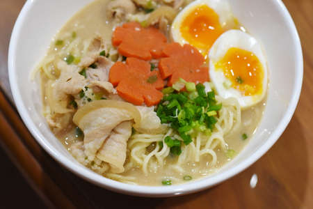 Rice noodle soup with pork, egg and vegetable in bowlの写真素材