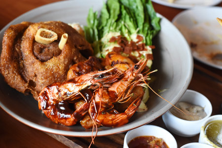 Grilled prawns with spicy sauce on plate, Thai food