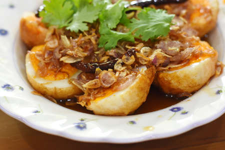 Stir fried egg with spicy sauce,Thai style food.の写真素材