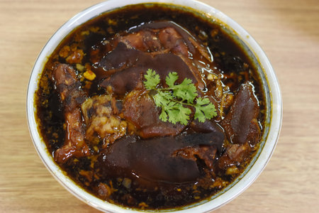 Braised pork ribs in sweet and sour sauce with coriander