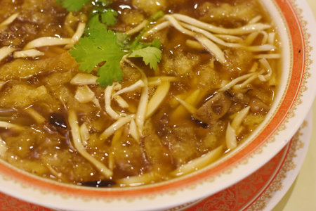 Noodle soup in a bowl, closeup of photo.の写真素材