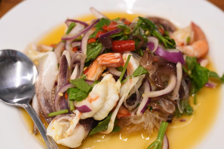 Thai spicy seafood salad with squid, shrimp and musselの写真素材