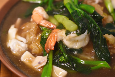 chinese food, hot and spicy soup with shrimps and vegetablesの写真素材