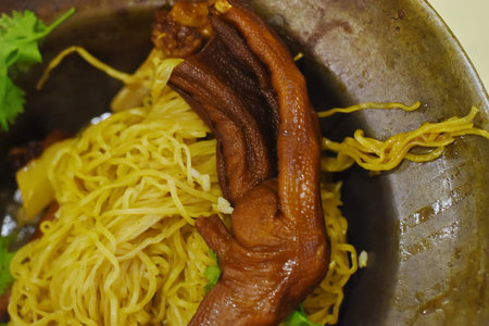 Chinese noodle soup with pork and vegetables, close-up.の写真素材