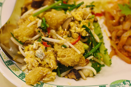 Thai food fried noodle with salted egg and shrimp.の写真素材