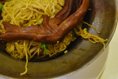 Egg noodle with pork on the table in the restaurant.の写真素材