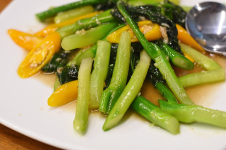 Stir-fried Vegetable with garlic and soy sauce on plateの写真素材
