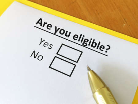 One person is answering question. He is thinking if he is eligible.の写真素材