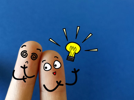 Two fingers are decorated as two person. One of them is clever but another one is slow learner.