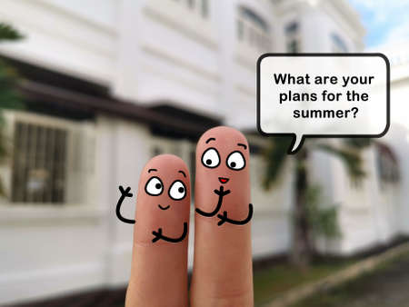 Two fingers are decorated as two person. They are discussing about summer plan.の写真素材