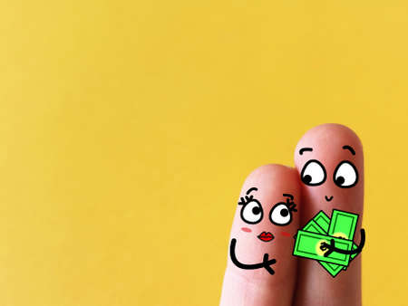Two fingers are decorated as two person. One of them is a prostitute.の写真素材
