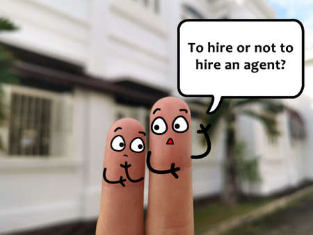 Two fingers are decorated as two person. They are discussing about hiring agent.の写真素材