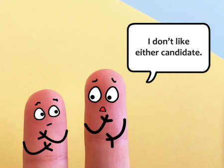 Two fingers are decorated as two person. They are discussing about election. One of them does not like the candidates.の写真素材