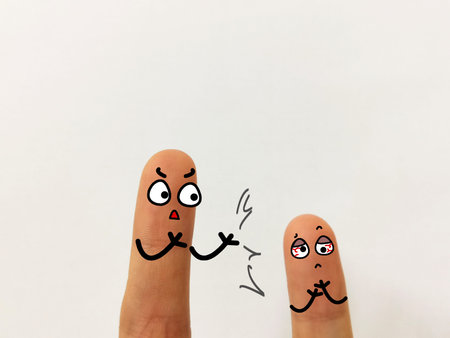 Two fingers are decorated as two person. One of them is scolding and bullying another one.