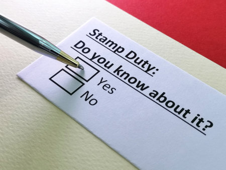 One person is answering question about stamp duty.の写真素材