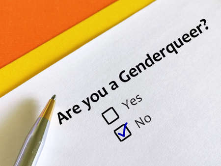 One person is answering question about sexual orientation. He is not a genderqueer.の写真素材