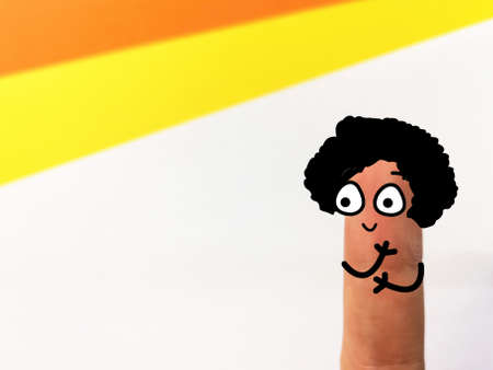 One finger is decorated as one person with curly hair.の写真素材