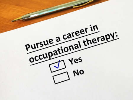 One person is answering question. He wants to pursue a career in occupational therapy.の写真素材