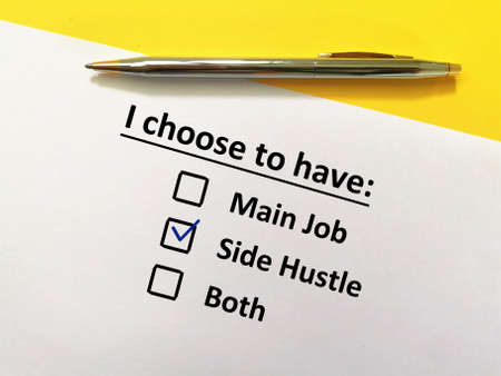 One person is answering question. He chooses to have side hustle.の写真素材