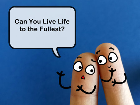 Two fingers are decorated as two person. One of them is asking if someone can live life to the fullest.の写真素材