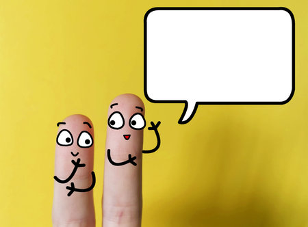 Two fingers are decorated as two person. One of them is asking  another about workplace issues after pandemic.の写真素材