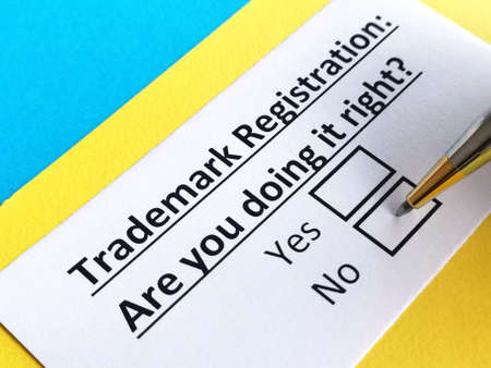 One person is answering question about trademark registration.の写真素材