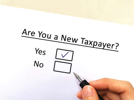 One person is answering question about taxation. He is a new taxpayer.の写真素材