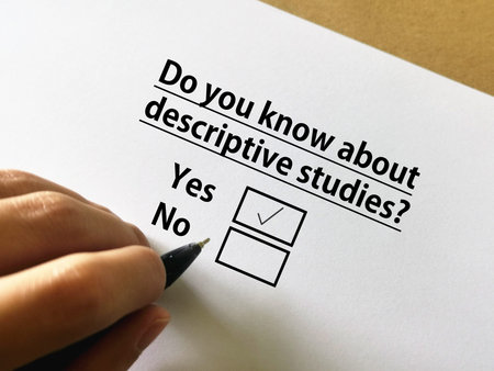One person is answering question about research. The person knows about descriptive studies.