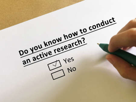 One person is answering question about economy. The person knows how to conduct an active research.の写真素材