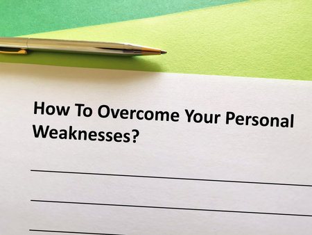 One person is writing his opinion. He is thinking how to overcome his personal weaknesses.