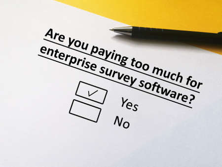 One person is answering question about payment and bill. He thinks he is paying too much for enterprise survey software.の写真素材
