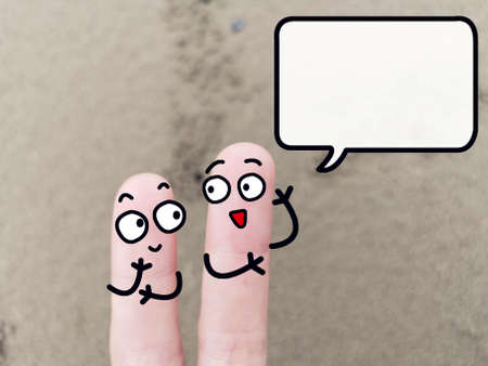 Two fingers are decorated as two person. One of them is asking another problem about sand mining.の写真素材