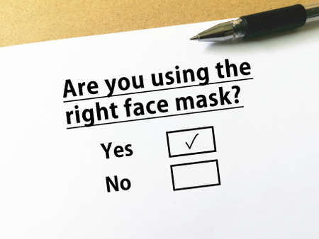 One person is answering question about cosmetics. She is using the right face mask.の写真素材