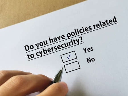 One person is answering question about cybersecurity. The person has policies related to cybersecurity.の写真素材